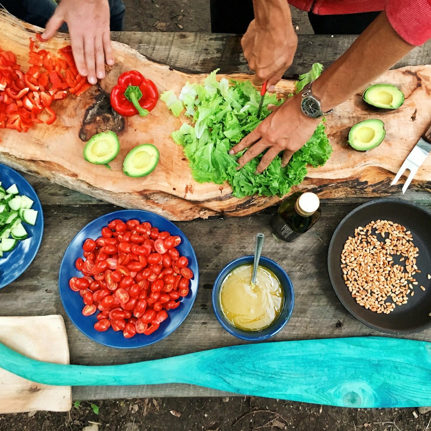 Community members collaborating in a modern kitchen space, sharing recipes and cooking techniques